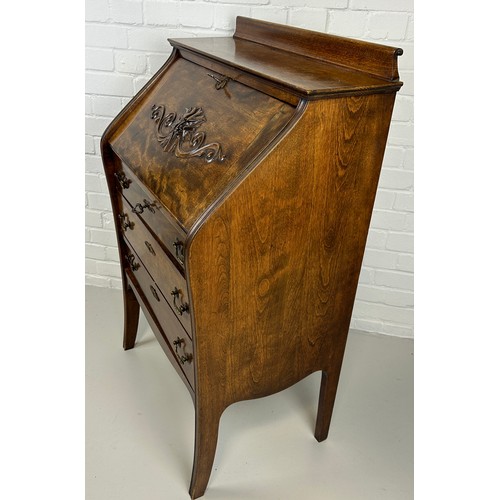 530 - AN OAK 'GREEN MAN' BUREAU, 

Drop front over three drawers. 

111cm H x 68cm W x 44cm D