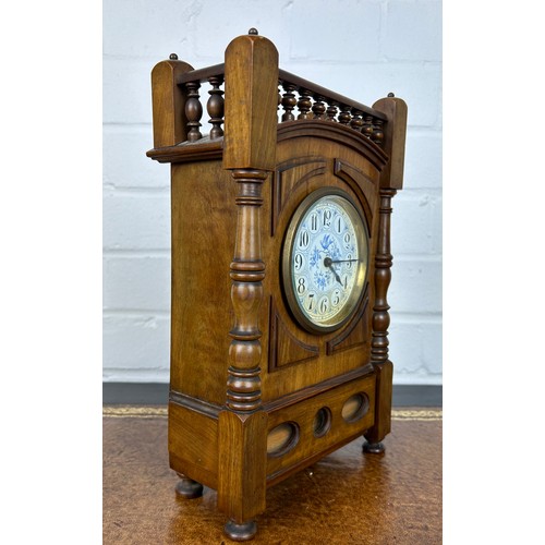 569 - AN ARTS AND CRAFTS WALNUT CASED MANTLE CLOCK IN THE MANNER OF LEWIS F DAY, 

28cm x 17cm x 8cm