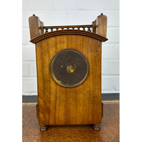 569 - AN ARTS AND CRAFTS WALNUT CASED MANTLE CLOCK IN THE MANNER OF LEWIS F DAY, 

28cm x 17cm x 8cm