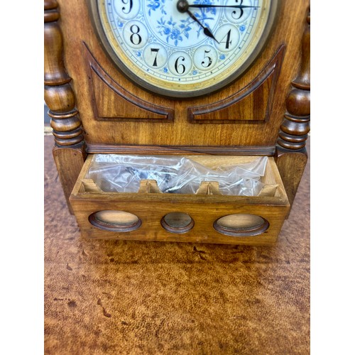 569 - AN ARTS AND CRAFTS WALNUT CASED MANTLE CLOCK IN THE MANNER OF LEWIS F DAY, 

28cm x 17cm x 8cm