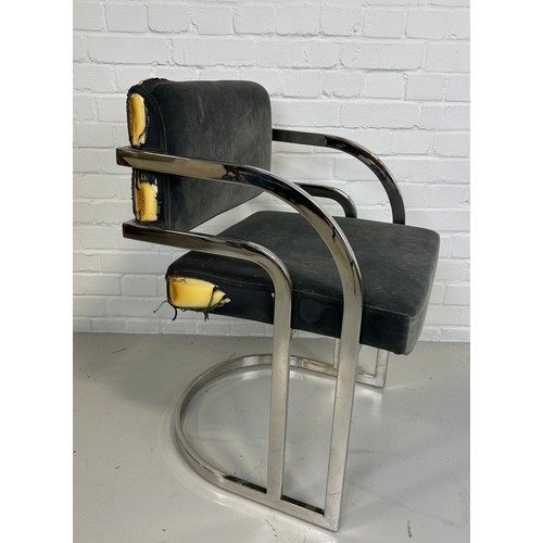 482 - A FIRE DAMAGED DESIGNER CHROME AND VELVET UPHOLSTERED CHAIR FROM THE FILM SET OF LUTHER, 

80cm x 52... 