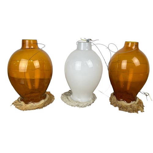 560 - A PAIR OF AMBER GLASS CEILING LIGHTS ALONG WITH AN OPAQUE GLASS CEILING LIGHT (3),

All with fringed... 