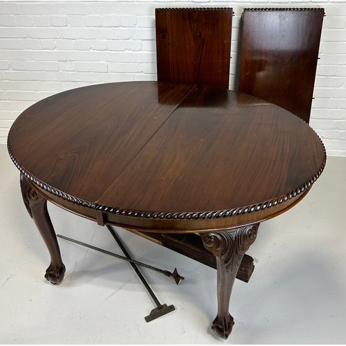 518 - A LARGE GEORGIAN DESIGN REPRODUCTION MAHOGANY DINING TABLE PURCHASED FROM HARRODS IN LONDON, 

With ... 