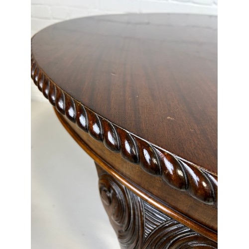 518 - A LARGE GEORGIAN DESIGN REPRODUCTION MAHOGANY DINING TABLE PURCHASED FROM HARRODS IN LONDON, 

With ... 