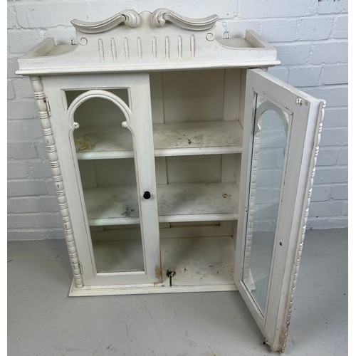 574 - A GUSTAVIAN DESIGN WHITE PAINTED HANGING BOOKCASE, 

Glazed doors revealing a shelved interior. 

97... 