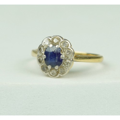 322 - A 14CT GOLD RING SET WITH A CENTRAL SAPPHIRE SURROUNDED BY TEN DIAMONDS, 

Weight: 2.8gms