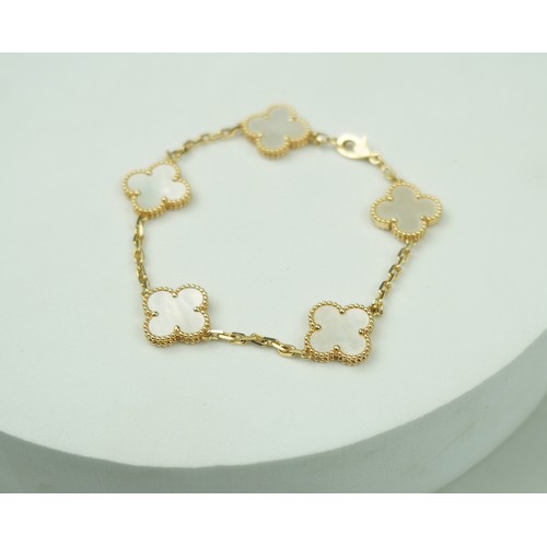 326 - A VAN CLEEF AND ARPELS 18CT GOLD AND MOTHER OF PEARL FLORAL BRACELET,

19cm L