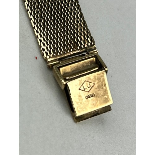 321 - A 9CT GOLD OMEGA WATCH,

Weight 26.7gms

Strap twisted.