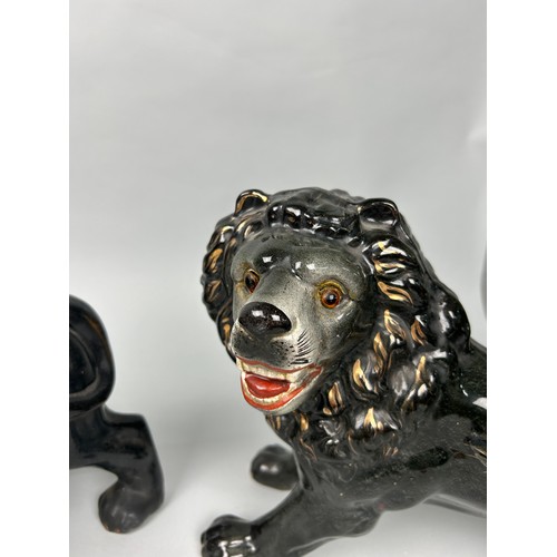 592 - A PAIR OF JACKFIELD POTTERY LIONS
35cm x 27cm