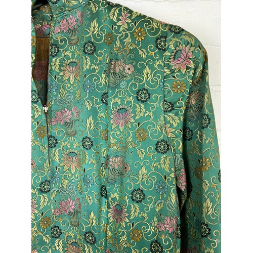 220 - A CHINESE GREEN SILK ROBE DECORATED WITH FLOWERS, 

Along with a black and gold thread dress.