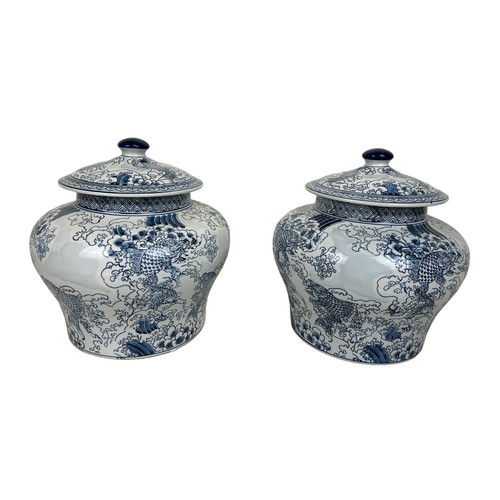 217 - A PAIR OF LARGE CHINESE 'CARP' DESIGN LIDDED JARS, 

34cm x 34cm each.