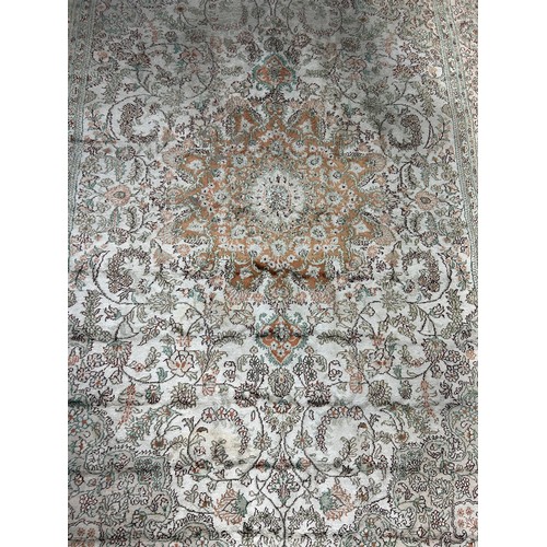 634 - A PERSIAN DESIGN CARPET,

275cm x 180cm