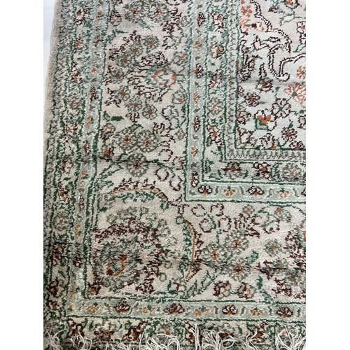 634 - A PERSIAN DESIGN CARPET,

275cm x 180cm