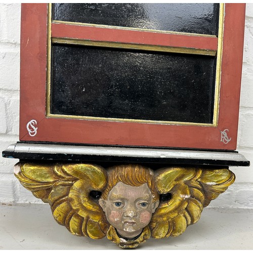 552 - A FLORENTINE DESIGN POLYCHROME PAINTED WALL HANGING SHOP FITTING WITH GILT WOOD WINGED PUTTI TO BASE... 