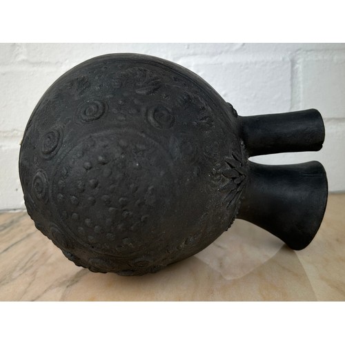 231 - A PRE COLUMBIAN CHIMU BLACK WARE VESSEL,

20cm x 18cm