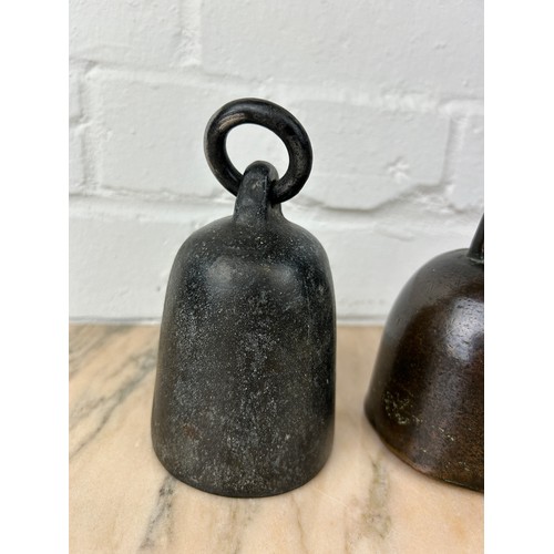 234 - THREE CAST IRON AND BRONZE BELLS (3), 

Largest 12cm x 7cm