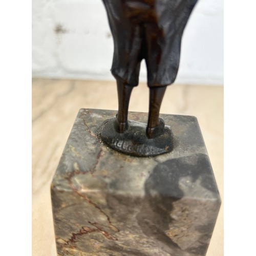 248 - AFTER FRANZ IFLAND (1862-1925): A SIGNED BRONZE CLOWN WITH A CAT, 

11cm H 
16cm with stand.