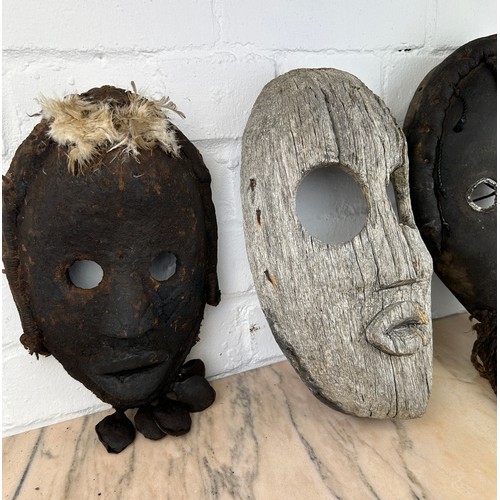 237 - A GROUP OF THREE AFRICAN TRIBAL 'DAN' MASKS FROM LIBERIA, 

Largest 30cm x 18cm