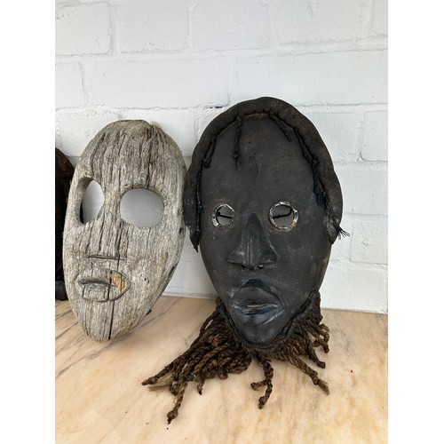 237 - A GROUP OF THREE AFRICAN TRIBAL 'DAN' MASKS FROM LIBERIA, 

Largest 30cm x 18cm