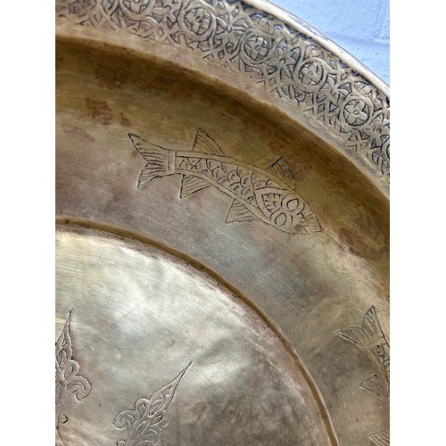 233 - A LARGE OTTOMAN HAMMAM BASIN, 

Hand raised Tombak, metal inscribed with fish and symbols. 

46cm x ... 