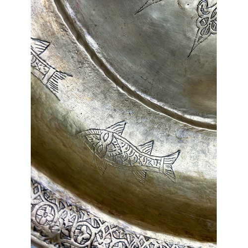 233 - A LARGE OTTOMAN HAMMAM BASIN, 

Hand raised Tombak, metal inscribed with fish and symbols. 

46cm x ... 