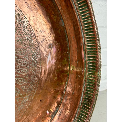 230 - A LARGE PERSIAN COPPER BASIN OR BOWL WITH SAFAVID TYPE ENGRAVINGS, 

47Ccm x 9cm