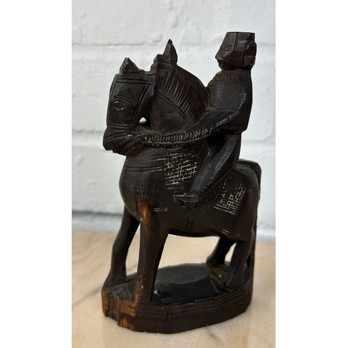 226 - AN INDIAN WOODEN SCULPTURE OF A HORSE AND RIDER, 

16cm x 9cm