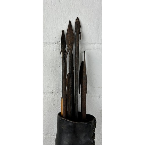 243 - AN AFRICAN TRIBAL QUIVER AND ARROWS, 

Possibly 19th Century. 

Quiver 52cm L

Arrows 55cm L