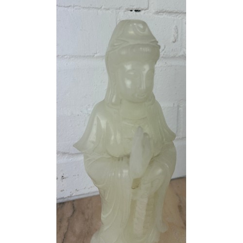 203 - A CHINESE WHITE JADE FIGURE OF A GUANYIN, 

Probably 20th century or modern. 

27cm H