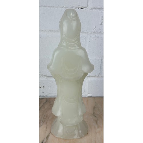 203 - A CHINESE WHITE JADE FIGURE OF A GUANYIN, 

Probably 20th century or modern. 

27cm H