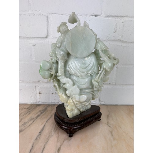 205 - A CHINESE JADE FIGURE OF A LUOHAN ON ROSEWOOD STAND, 

Probably 20th century or modern. 

Jade 24cm ... 