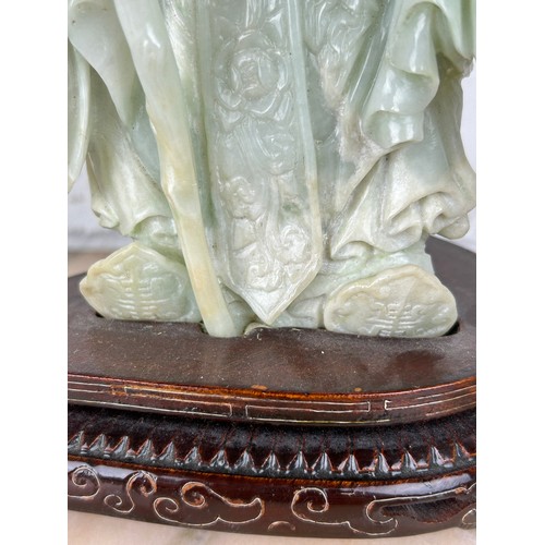 205 - A CHINESE JADE FIGURE OF A LUOHAN ON ROSEWOOD STAND, 

Probably 20th century or modern. 

Jade 24cm ... 