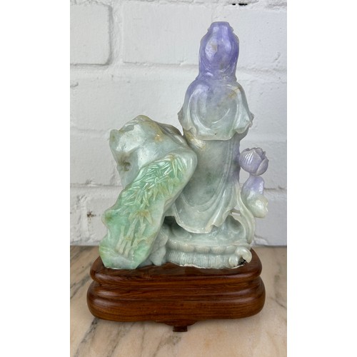 206 - A CHINESE JADE CARVED FIGURE OF A GUANYIN, 

Probably 20th Century or modern. 

The jade 21cm x 14cm