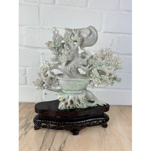 207 - A CHINESE JADE GROUP OF BIRDS ON BRANCHES ON ROSEWOOD STAND,

Probably 20th century or modern.

The ... 