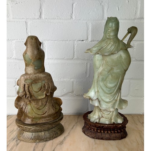 209 - TWO LARGE CHINESE JADE FIGURES OF THE GUANYIN, 

One on wooden stand. 

Probably 20th century, or mo... 