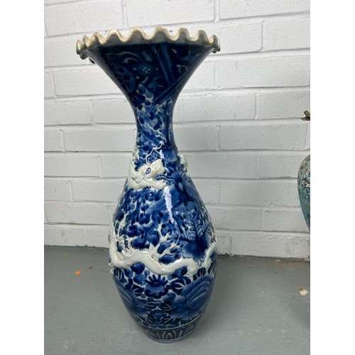 591 - A TURQUOISE CLOISONNE VASE AND A BLUE AND WHITE VASE WITH DRAGONS (2)

Largest 55cm H