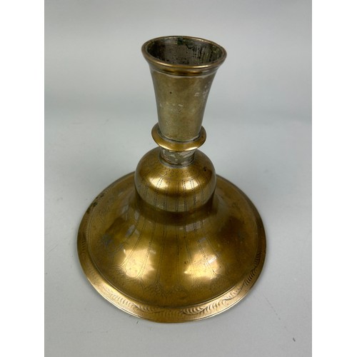 225 - AN ISLAMIC BRASS CANDLESTICK, 

20cm x 20cm