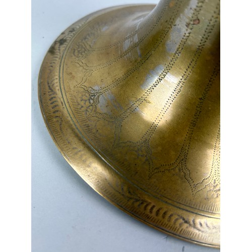 225 - AN ISLAMIC BRASS CANDLESTICK, 

20cm x 20cm