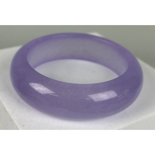 212 - A PURPLE JADE BANGLE,

7cm D

Weight 71gms