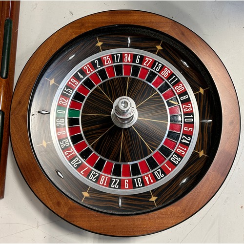 505 - PALM BEACH CASINOS: A FULL SIZE ROULETTE WHEEL BY JOHN HUXLEY ALONG WITH ROULETTE TABLE, 

The wheel... 