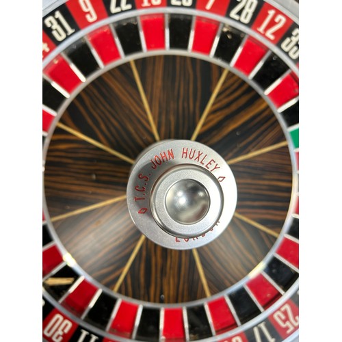 505 - PALM BEACH CASINOS: A FULL SIZE ROULETTE WHEEL BY JOHN HUXLEY ALONG WITH ROULETTE TABLE, 

The wheel... 