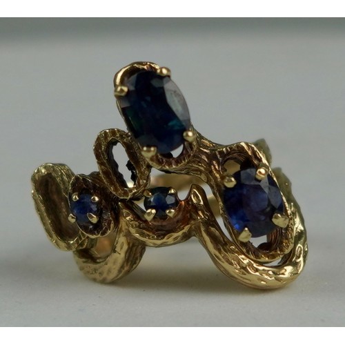 335 - A TWO PIECE 1970'S 14CT GOLD RING SET WITH SAPPHIRES, 

Weight: 10.7gms 

The bark effect rings of a... 