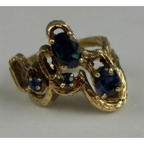 335 - A TWO PIECE 1970'S 14CT GOLD RING SET WITH SAPPHIRES, 

Weight: 10.7gms 

The bark effect rings of a... 