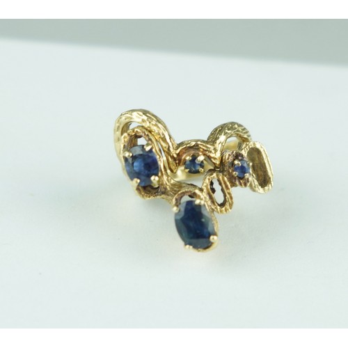 335 - A TWO PIECE 1970'S 14CT GOLD RING SET WITH SAPPHIRES, 

Weight: 10.7gms 

The bark effect rings of a... 