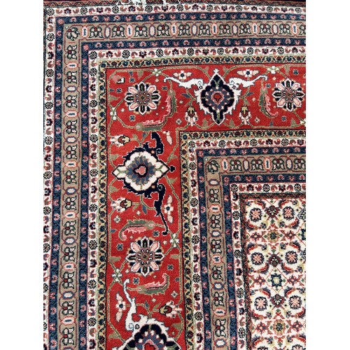 636 - A VERY LARGE AND FINE PERSIAN CARPET WITH LABEL FROM HARRODS FOR £9,950,

630cm x 315cm