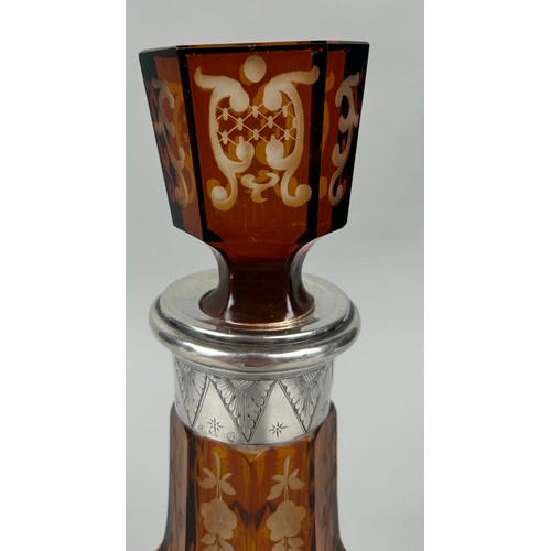 259A - AN AMBER GLASS DECANTER WITH SILVER COLLAR CIRCA 1900, 

30cm H

Possibly Venetian, or Spanish.