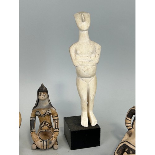 523 - A SCULPTURE AFTER HENRY MOORE ALONG WITH A COLLECTION OF KARAJA TRIBE POTTERY FIGURES (9) 

Some dam... 