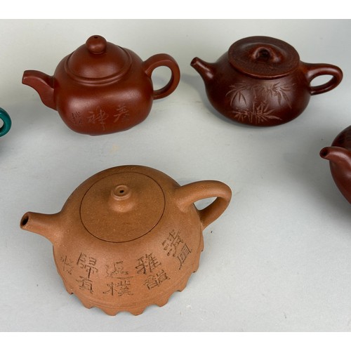 41 - A COLLECTION OF CHINESE YIXING CLAY TEA POTS AND COVERS (5) 

All with seal marks to verso. 

Larges... 