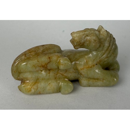 88 - A CHINESE CARVED JADE FIGURE OF A HORSE, 

8cm x 4cm