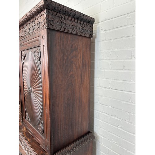 419 - A 19TH CENTURY ANGLO INDIAN ROSEWOOD SECTIONAL WARDROBE WITH SUNBURST DESIGN PANELS, 

194cm x 120cm... 